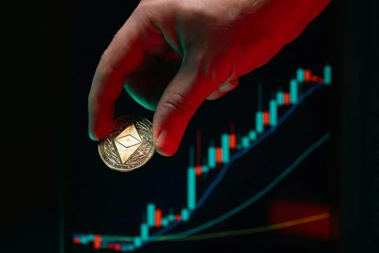 A hand holds an Ethereum coin in front of a rising candlestick chart, symbolizing Ethereum Business Solutions like smart contracts, DeFi platforms, and tokenization driving innovation in digital finance.
