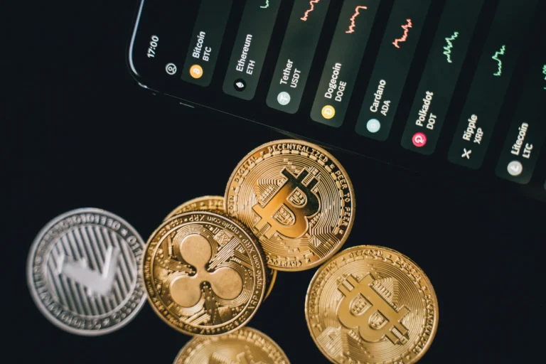 A smartphone displaying cryptocurrency prices alongside digital coins represents the impact of AI in FinTech on modern finance and digital lending
