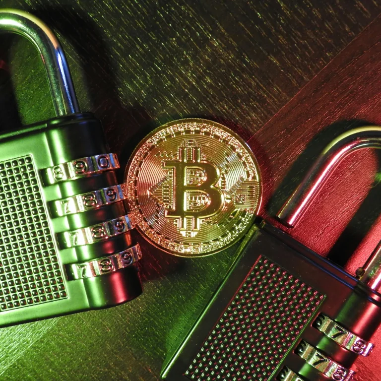 A gold Bitcoin coin rests between two metallic combination padlocks on a dark wood surface, illuminated by moody green and red lighting, representing Crypto Security Innovations Strengthening Digital Asset Trust through visual metaphors of encryption, asset protection, and the evolving standards of blockchain security in decentralized finance.