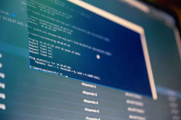 A computer screen displays a command-line interface with network diagnostics showing 100% packet loss and a “HELP ME…” prompt, symbolizing Industry Marketing Trends Driving Growth and Digital Innovation through real-time troubleshooting, digital infrastructure awareness, and the evolving role of tech resilience in shaping marketing agility and operational continuity.