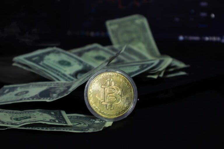 A gold Bitcoin coin engraved with “BITCOIN DIGITAL DECENTRALIZED PEER TO PEER CRYPTOCURRENCY” sits atop U.S. dollar bills, with a dark digital background hinting at financial data, symbolizing 2026 Cryptocurrency Investment Strategies for Sovereign Growth through decentralized asset positioning, fiat-to-crypto diversification, and strategic adoption of blockchain technologies that empower founders and nations to build resilient, borderless financial ecosystems.