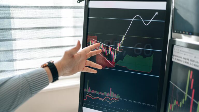 A person points at a computer monitor displaying a 60-minute financial chart with candlestick patterns, volume bars, moving averages, and Ichimoku clouds, alongside a white upward arrow and curved line indicating a bullish forecast, symbolizing Stock Trading Trends for Modern Portfolios through technical analysis, predictive modeling, and real-time market signals that guide founders and investors in optimizing portfolio performance and navigating dynamic equity environments.