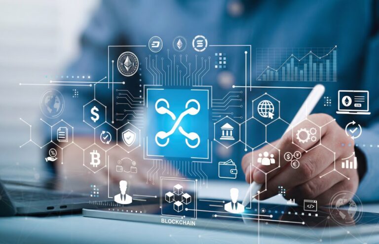 A person uses a stylus on a digital tablet displaying blockchain graphics surrounded by cryptocurrency symbols, financial icons, and data charts, with a laptop and professional setting in the background, symbolizing The Institutional Pivot 2026 Crypto News and DeFi Trends through enterprise-grade blockchain adoption, decentralized finance integration, and strategic digital infrastructure that empower founders and institutions to navigate crypto regulation, tokenized liquidity, and market-shaping innovation.